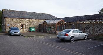 The Barns offices at Caddsdown and adjacent parking spaces