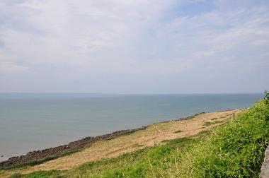 LCT 2C Rough grassland slope running down to meet rocky foreshores south of Saunton Down.