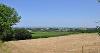 DCA 32: View north-east from Huish Moor towards wind turbines at Collacott Wind Farm.