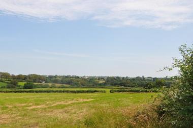 LCT 5A View across hedgerow-bound pasture fields and wooded valleys towards Bradworthy.