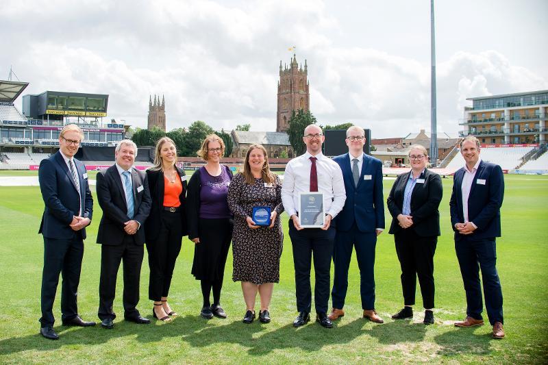 TDC Planning Team flanked on right and left by a representative from the award sponsors