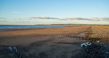 Photo of Westward Ho! beach, at early sunset. 