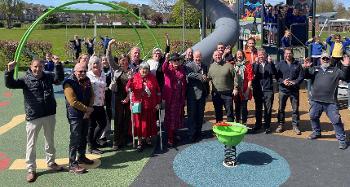 Photo of people stood in the new park for the opening 