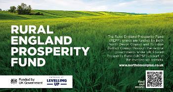 Picture of vivid green field with blue sky and the text Rural England Prosperity Fund