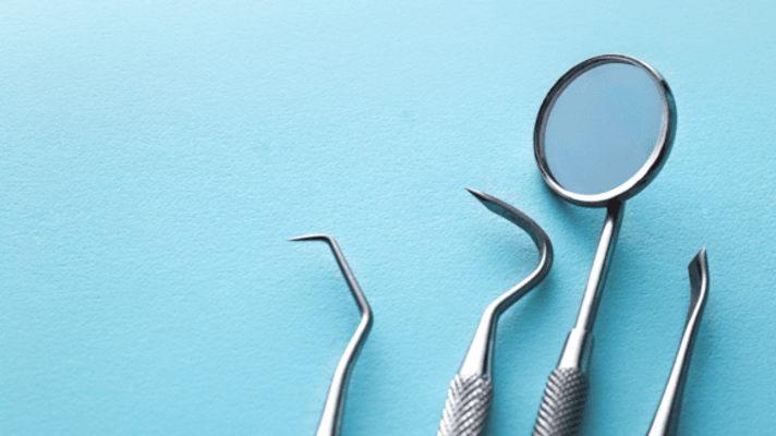 Dental tools on a blue background