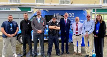 Photo of Torridge Officers, Councillors and a police officer smiling for a photo in Bideford