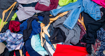 Pile of multicoloured clothes on the ground