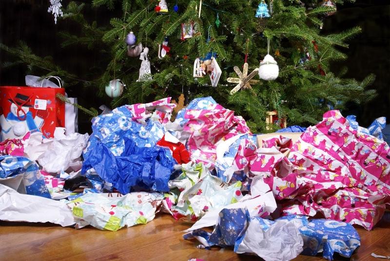 Christmas wrapping paper beneath a Christmas tree