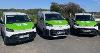 Photo of 3 of the new TDC Electric Vehicles, they are white vans with green bonnets