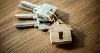 Picture of house keys with a wooden house keyring