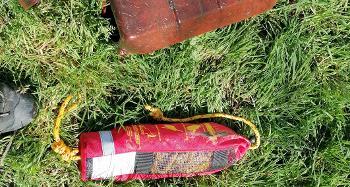 Photo of essential life-saving equipment that has been vandalised, placed on the grass.