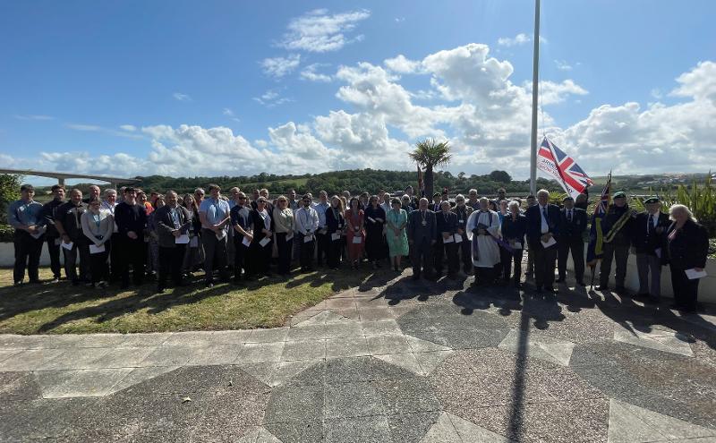 Torridge Officers and Councillors commemorating armed forces day by Riverbank House's flagpole