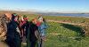 Group of people looking across the estuary as part of their guided walk, birdspotting.